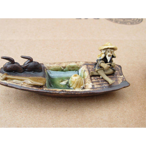Fisherman On A Boat Fishing With Duck Ceramic Figurine