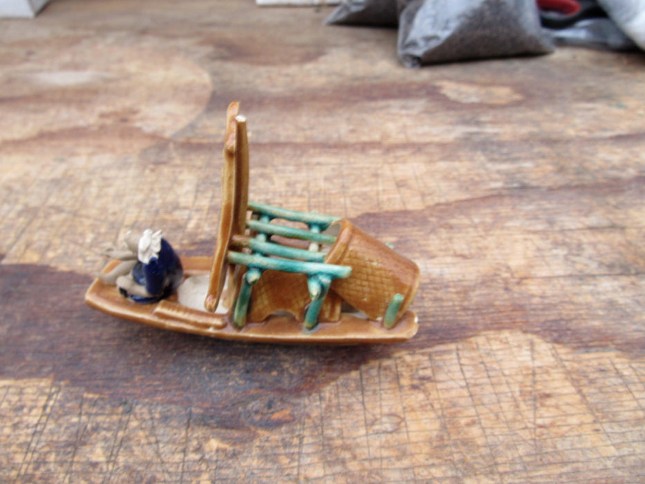 Man on a Large Sampan Boat Figurine Top