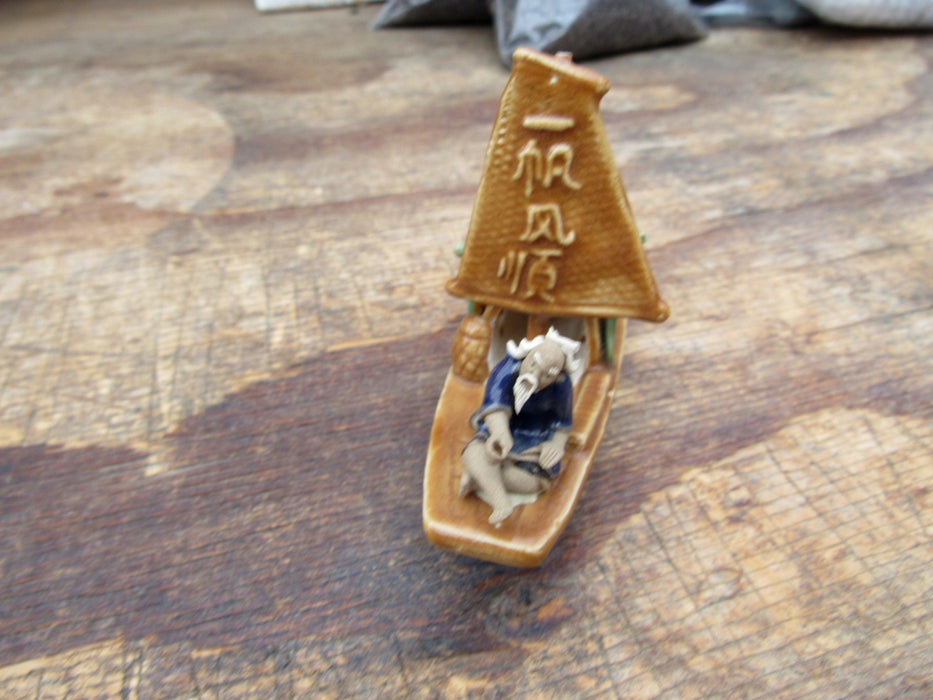 Man on a Large Sampan Boat Figurine Front