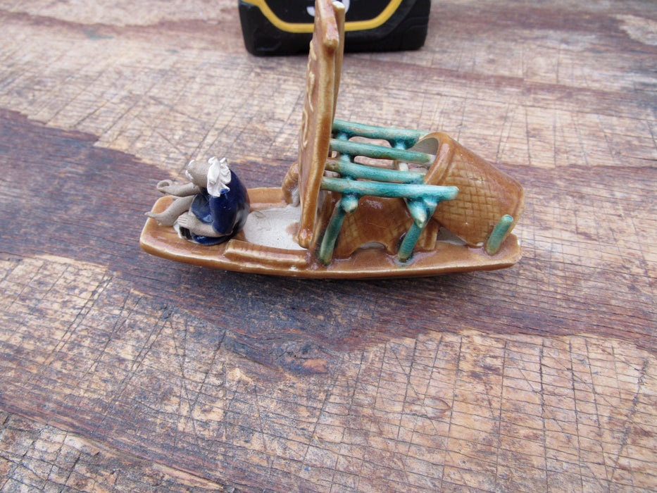 Man on a Large Sampan Boat Figurine Close