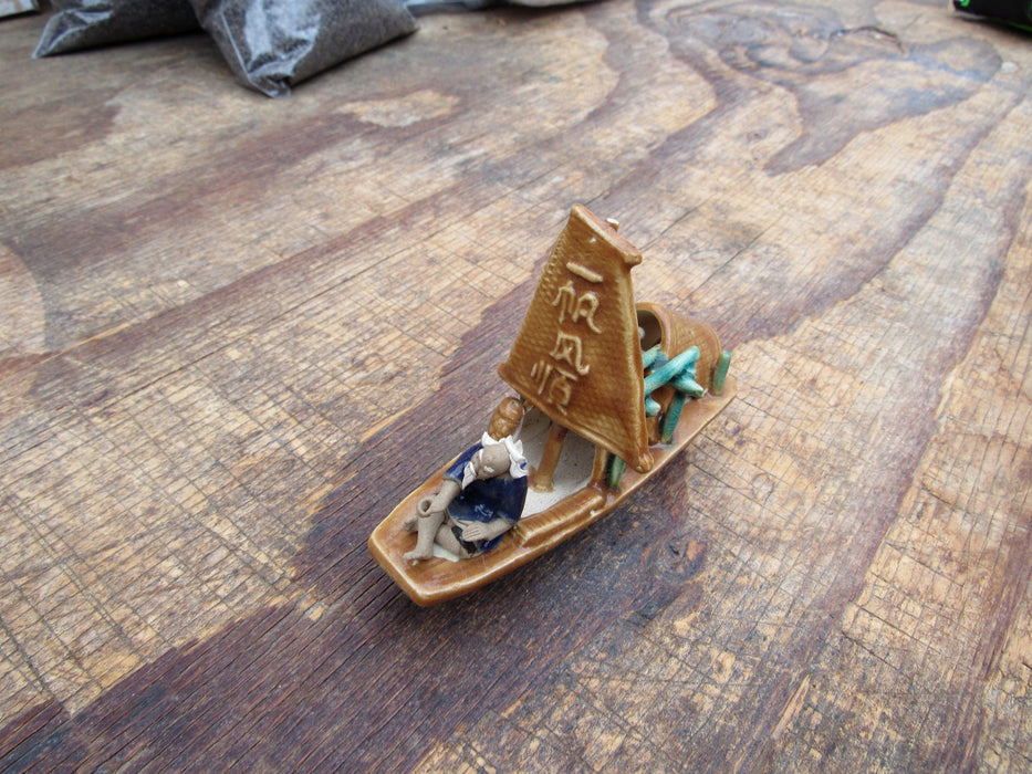 Man on a Large Sampan Boat Figurine