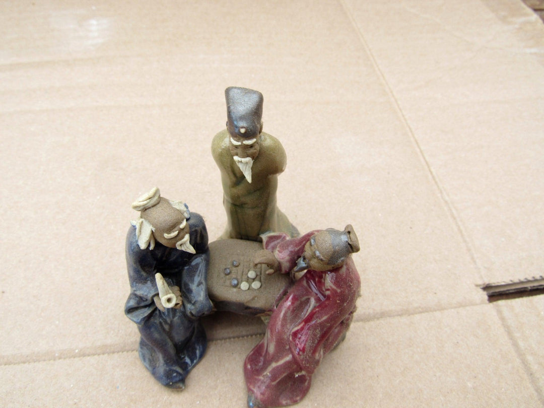 Men Playing Go Figurine Top