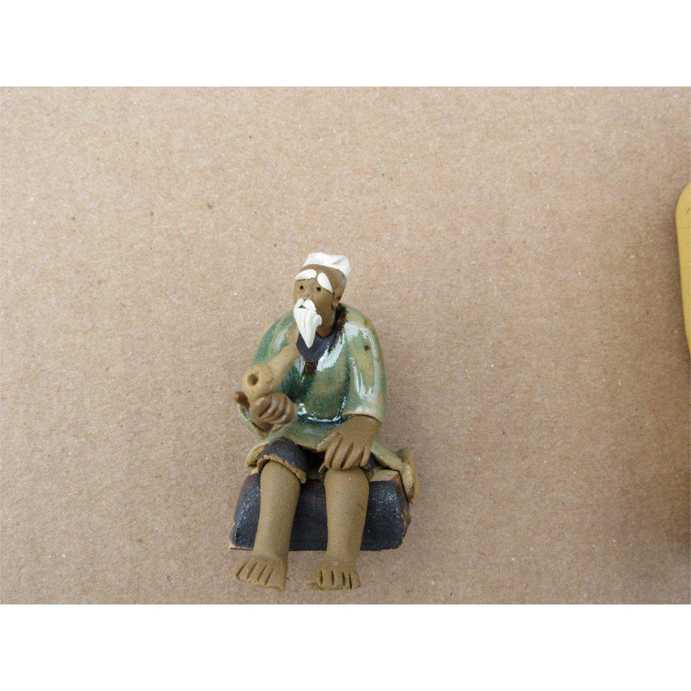 Old Man And His Pipe Ceramic Figurine