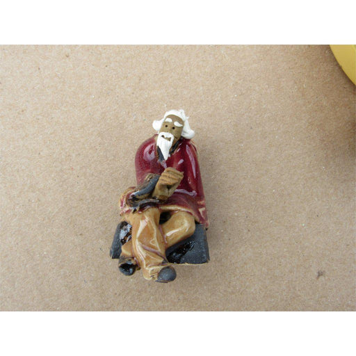 Old Man On A Bench Ceramic Figurine