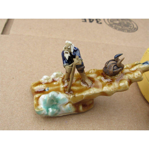 Wave Rider On A Raft Ceramic Figurine